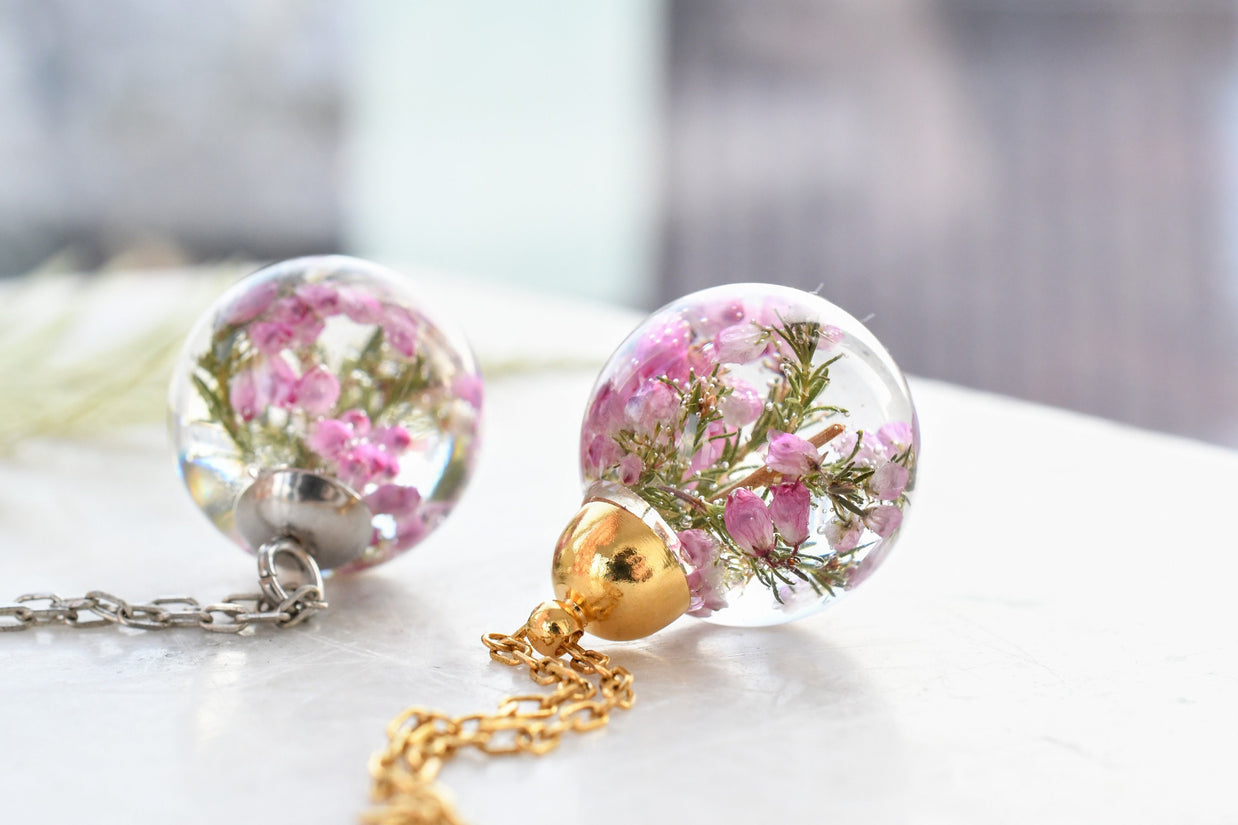 Side view of resin sphere pendant showing clarity and gentle floral detail