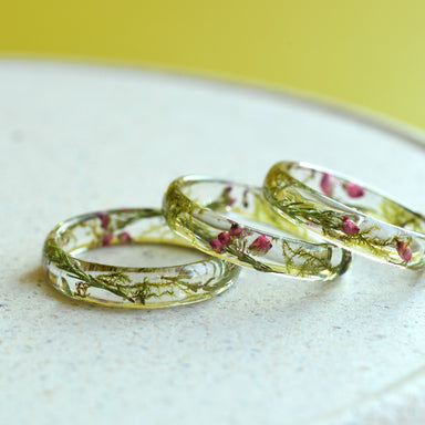 Detailed shot of the &#39;Enchanted Whisper&#39; ring, highlighting its botanical elements and sweet elegance.