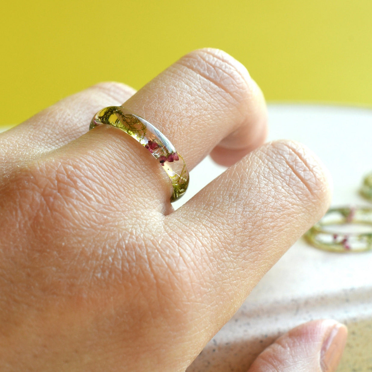 Macro image of the handmade ring featuring a harmonious blend of textures and organic elements.