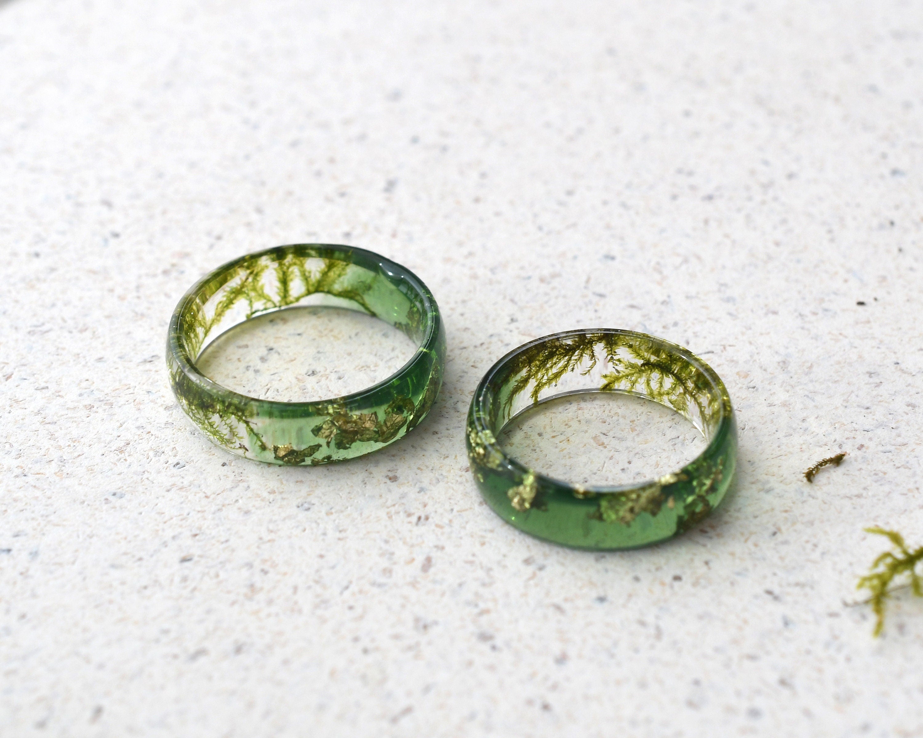 a couple of green rings sitting on top of a white floor