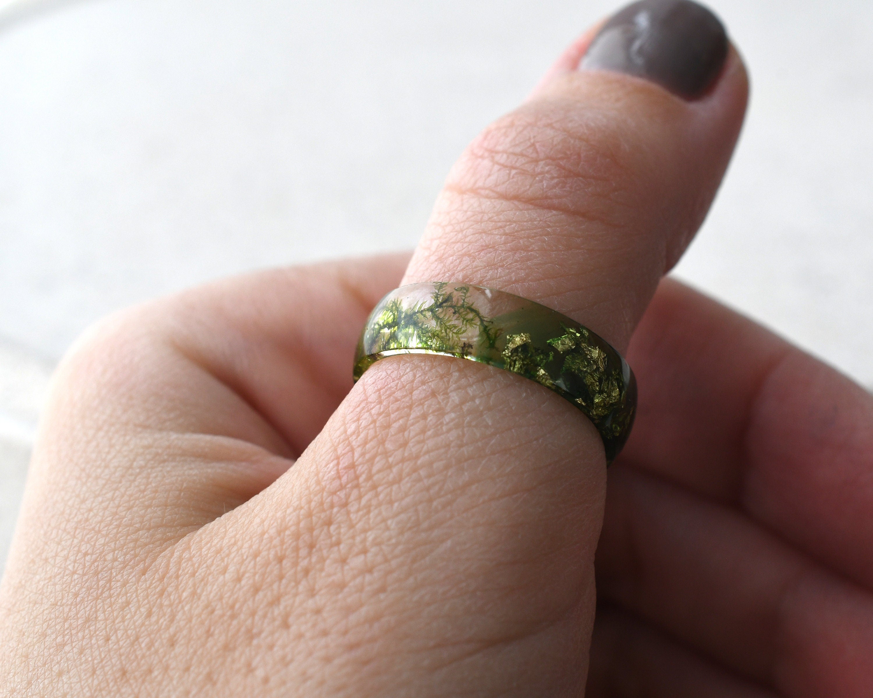 a person with a ring on their finger