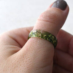 a person with a ring on their finger
