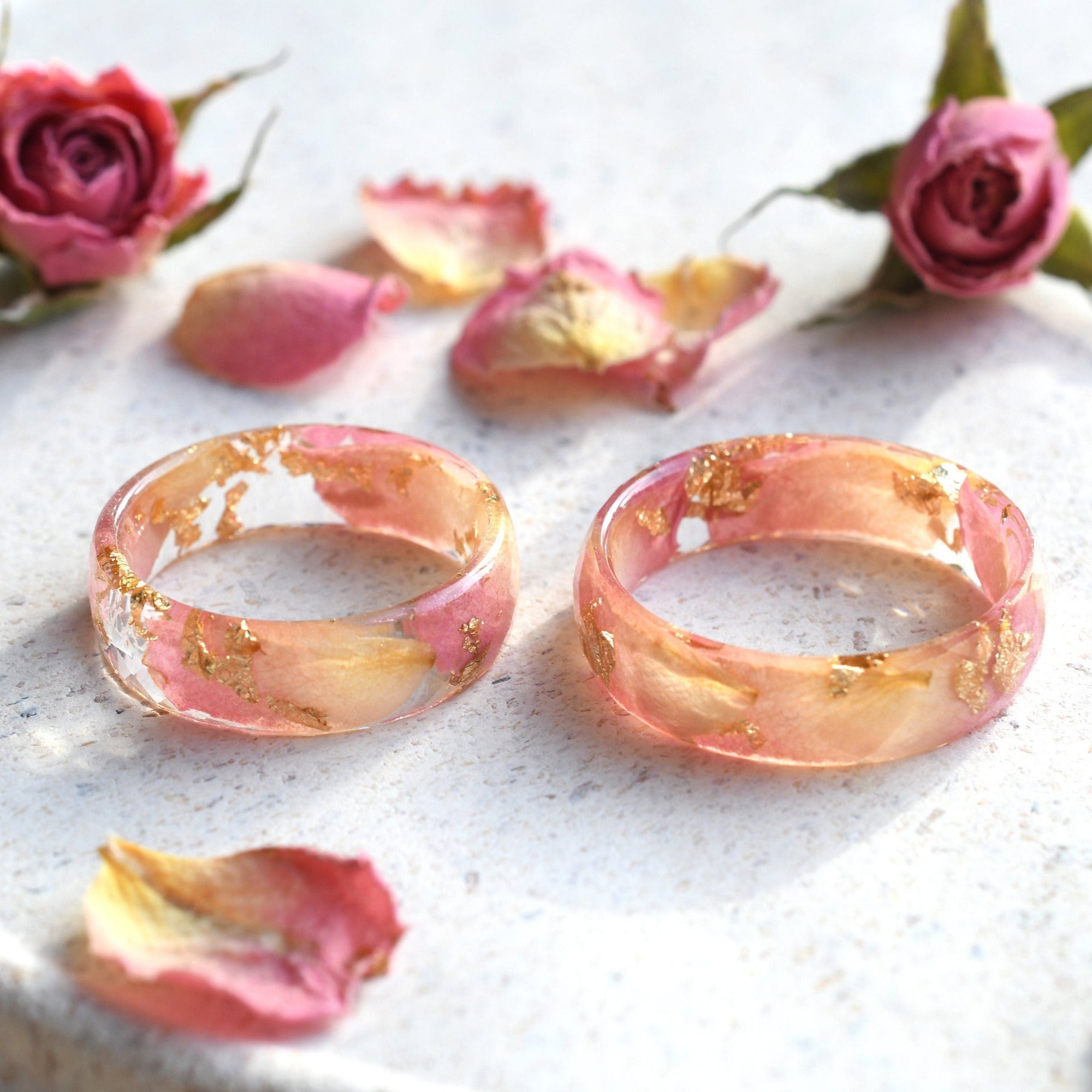 a couple of rings sitting on top of a white plate