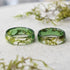 two green rings sitting on top of a white table