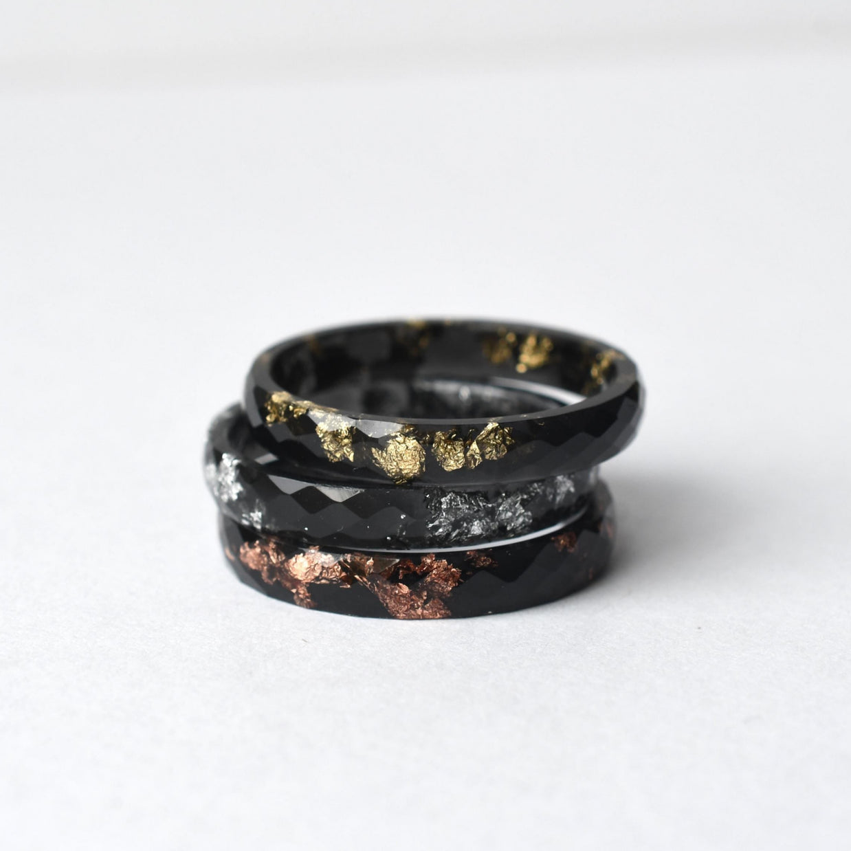Unisex black resin ring featuring silver metallic leaf inside, modern and minimalist