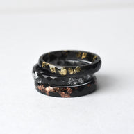 Unisex black resin ring featuring silver metallic leaf inside, modern and minimalist