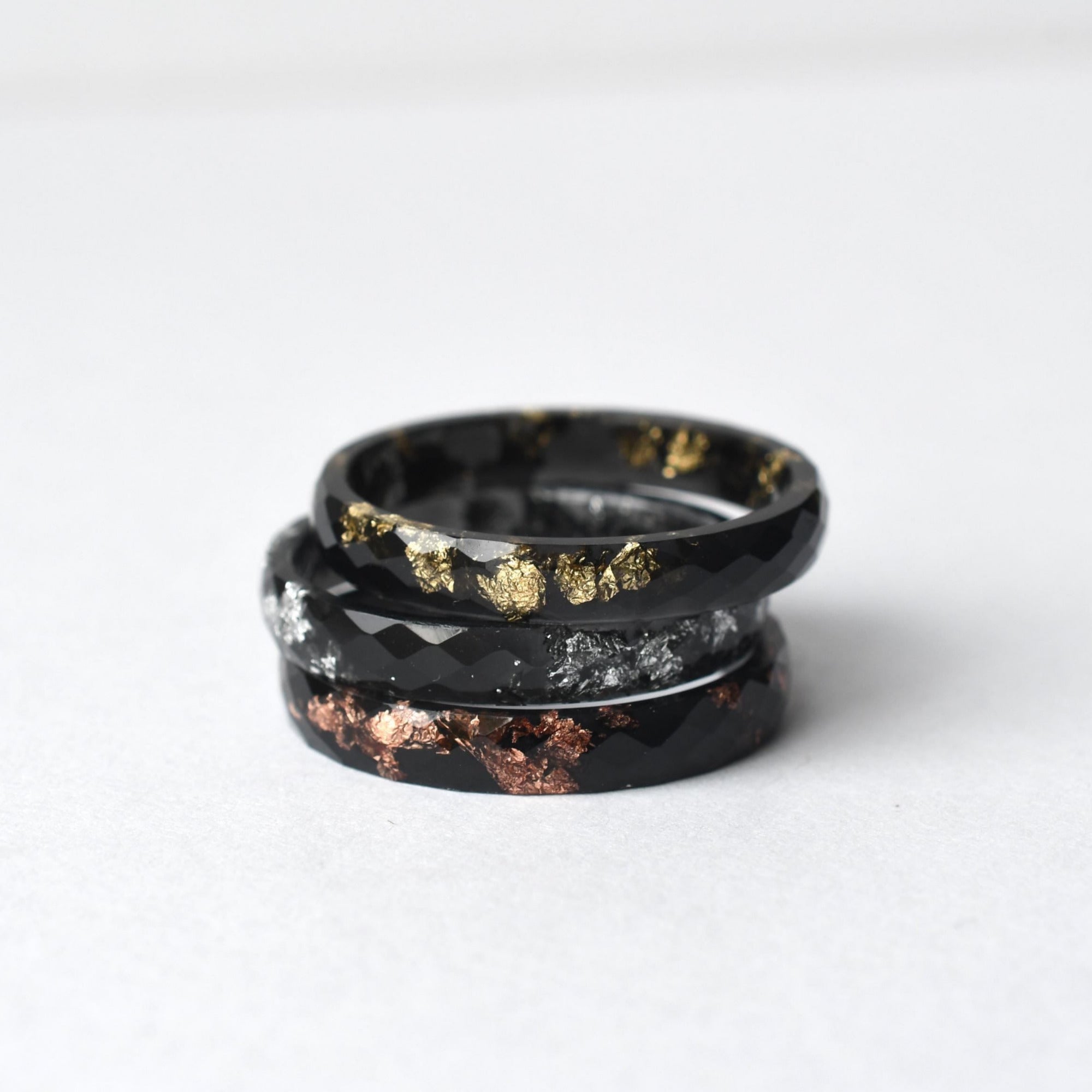 Unisex black resin ring featuring silver metallic leaf inside, modern and minimalist