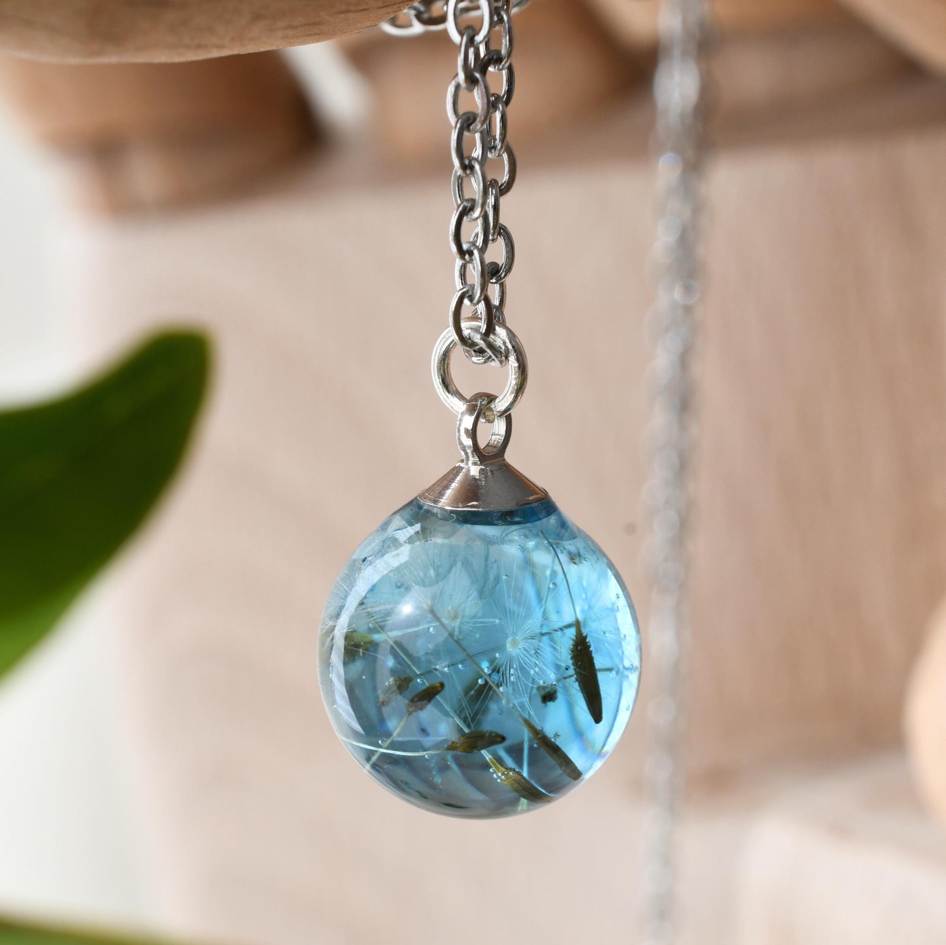 Water-like resin pendant with real seed