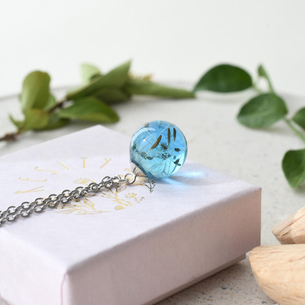 Dandelion seed in aqua blue resin necklace
