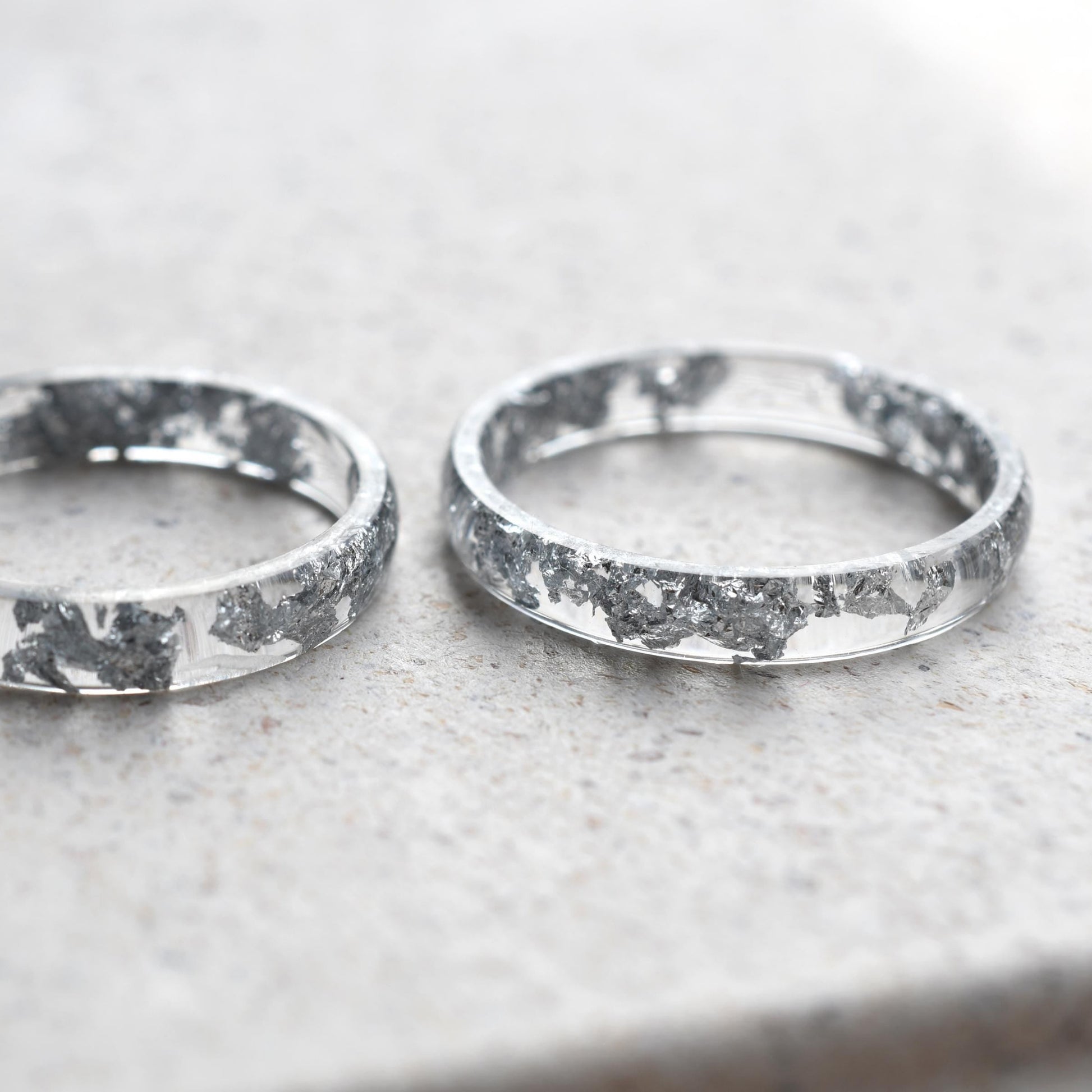 Lumen Ring stacked with other resin bands for a clean, elegant layering look