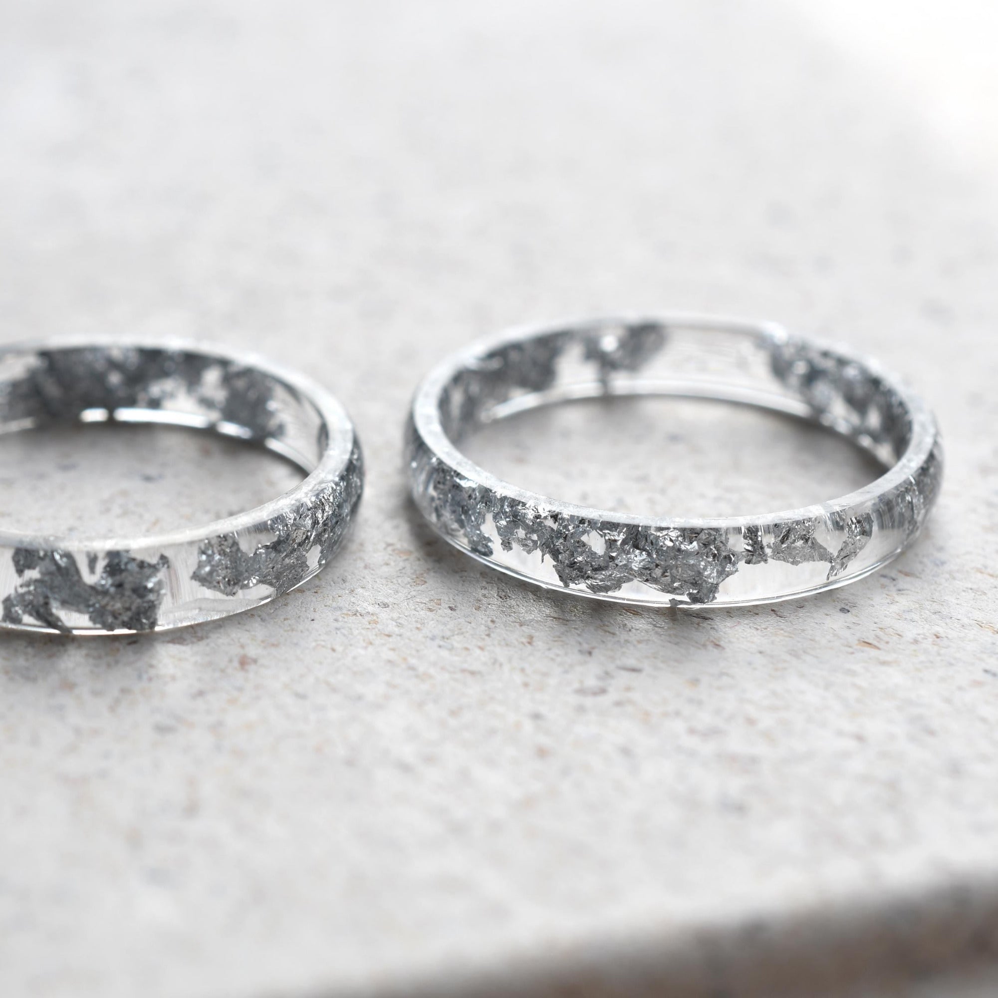 Lumen Ring stacked with other resin bands for a clean, elegant layering look