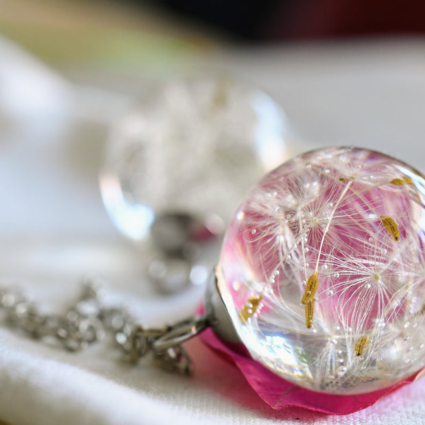 Close-up of resin pendant with dandelion seed