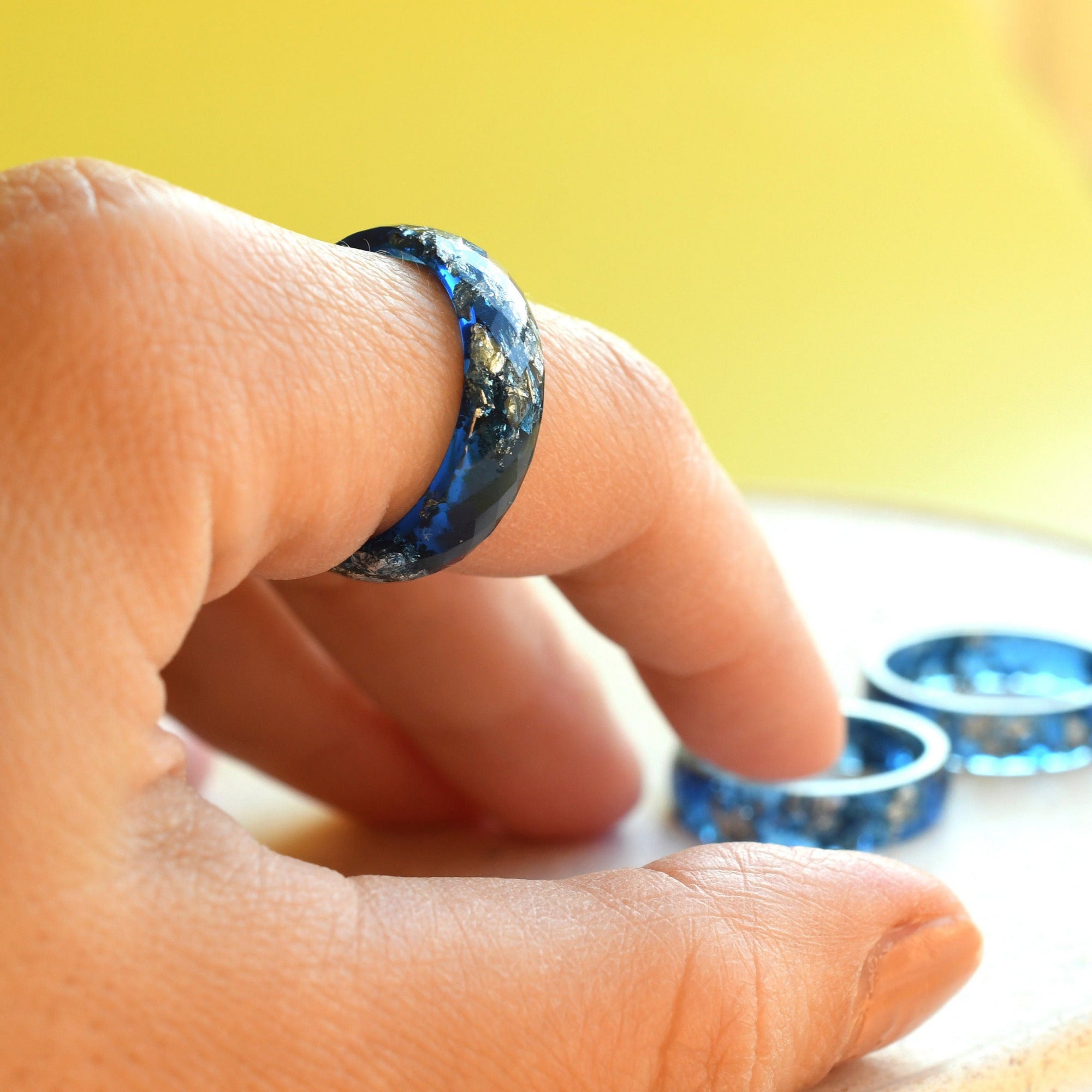 Midnight Signal Ring worn on hand, showcasing its deep color and bold, clean design