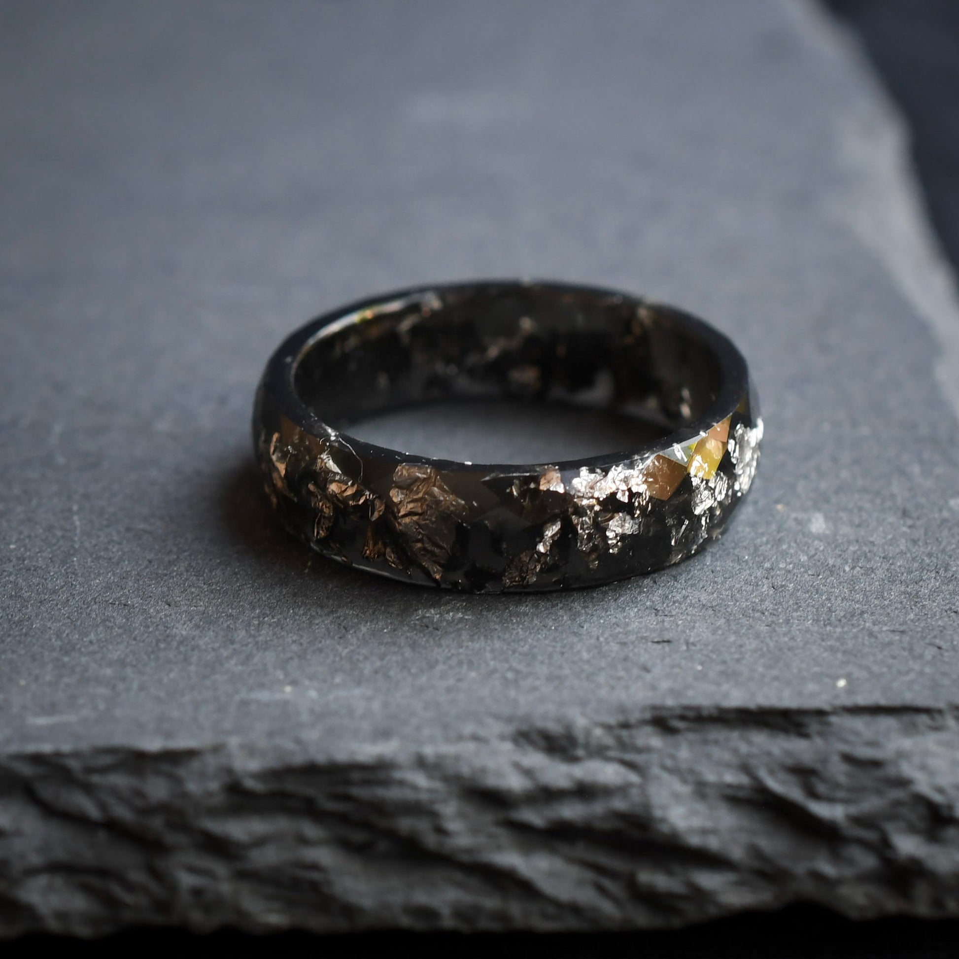 Modern geometric black men’s ring with silver reflective detail