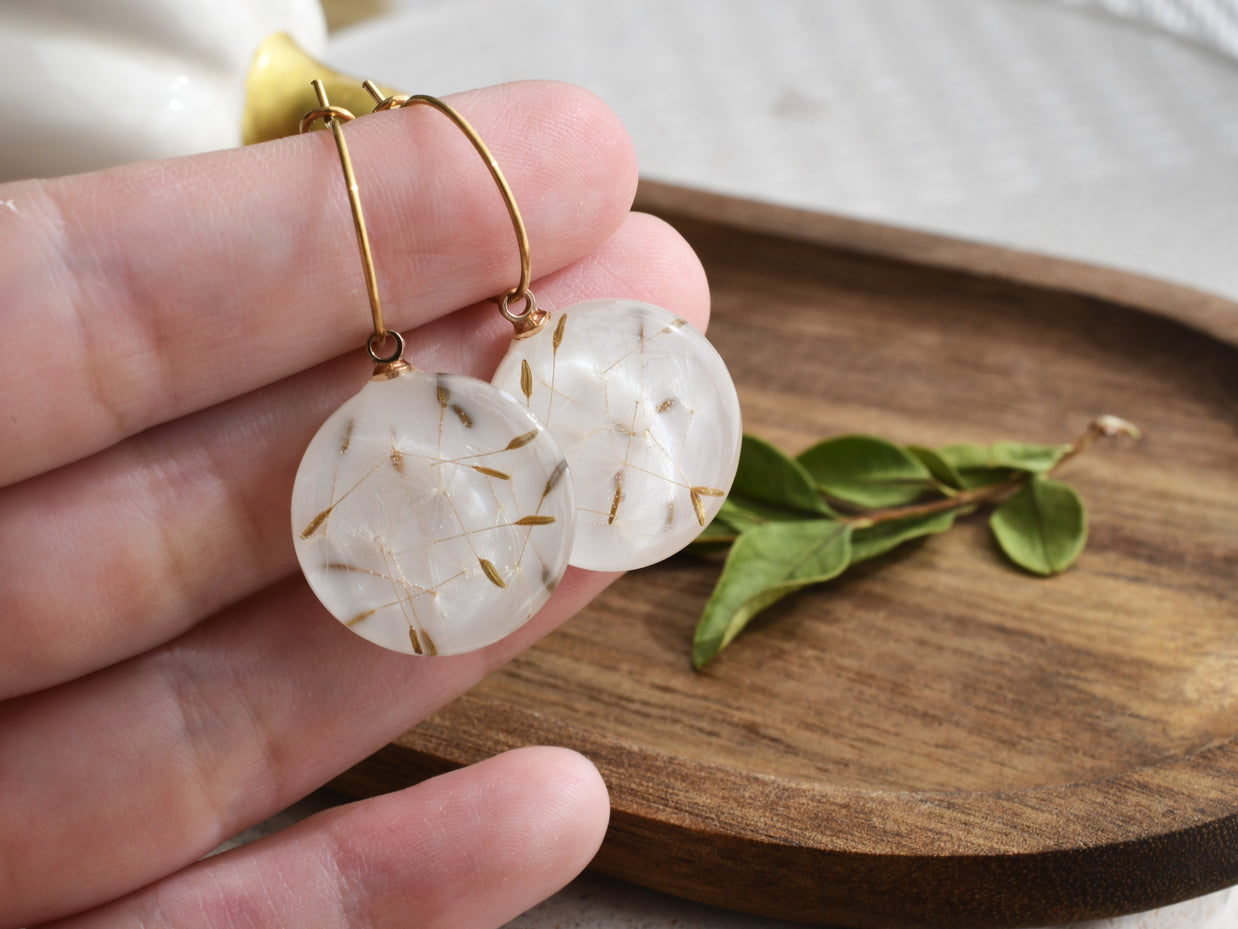 Minimalist resin hoop earrings with delicate dried dandelion seeds, handmade botanical fashion accessory