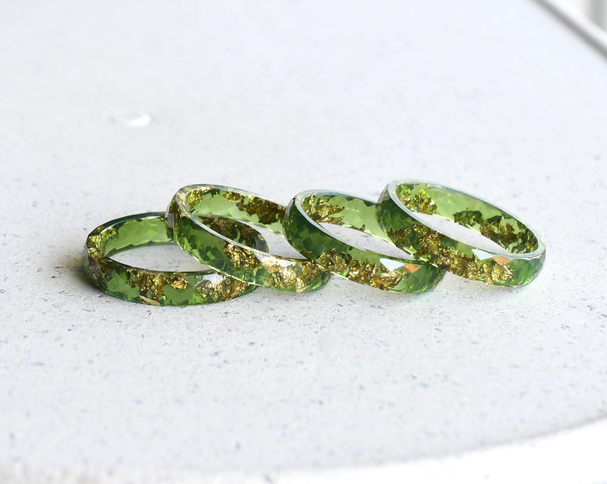Moss green resin ring with gold flakes handmade by Resity in Vienna