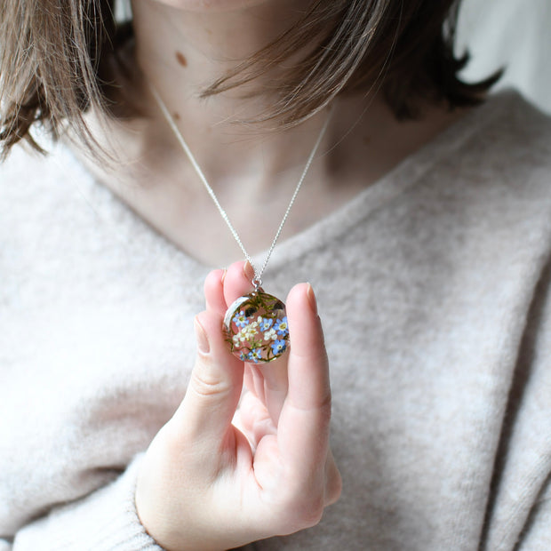 Cottagecore necklace with moss, mushrooms, and real flowers preserved in clear resin