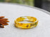 Narcissus resin ring with gold leaf — handcrafted botanical art jewelry from Vienna