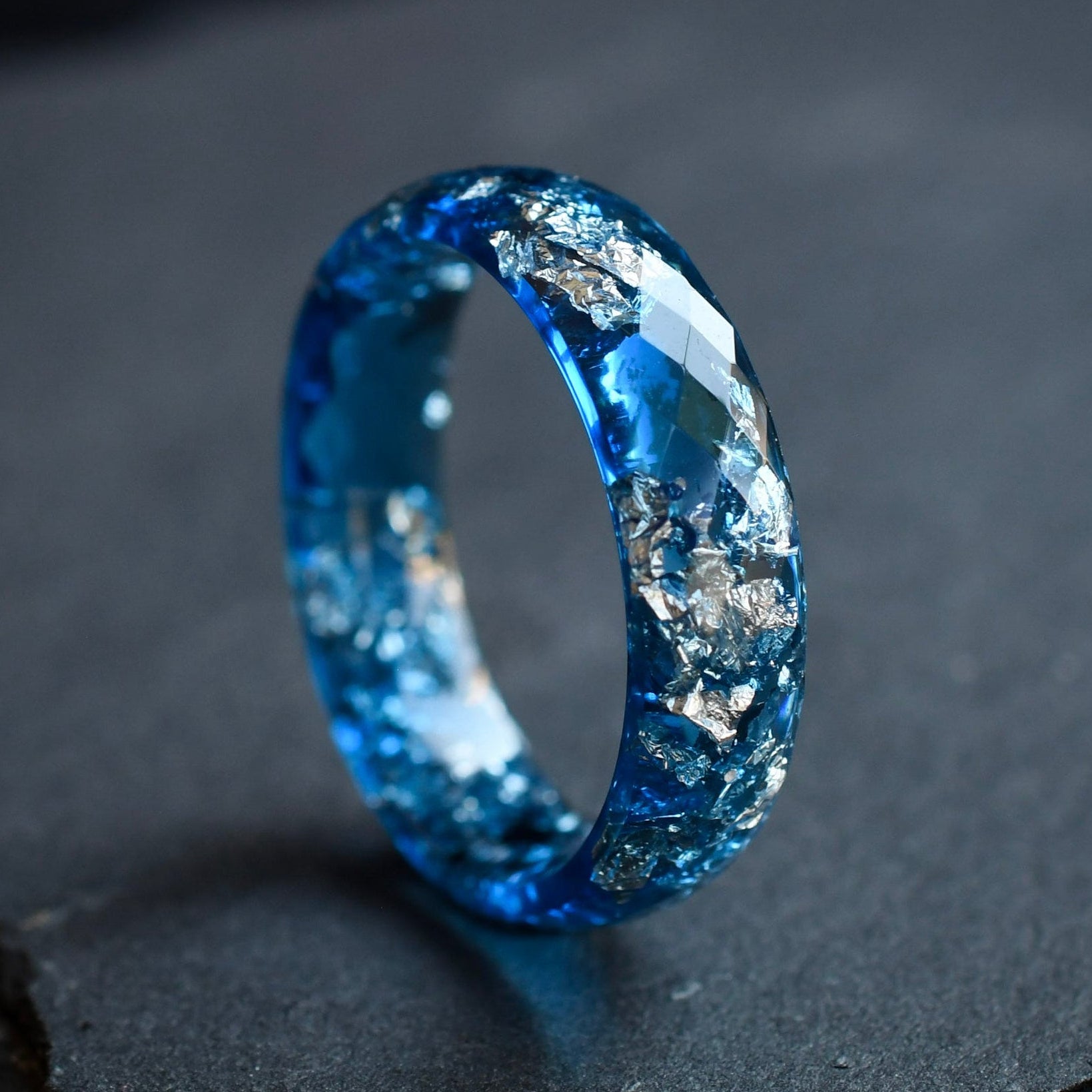 Handmade navy blue mens resin ring with silver leaf faceted close-up Vienna craftsmanship