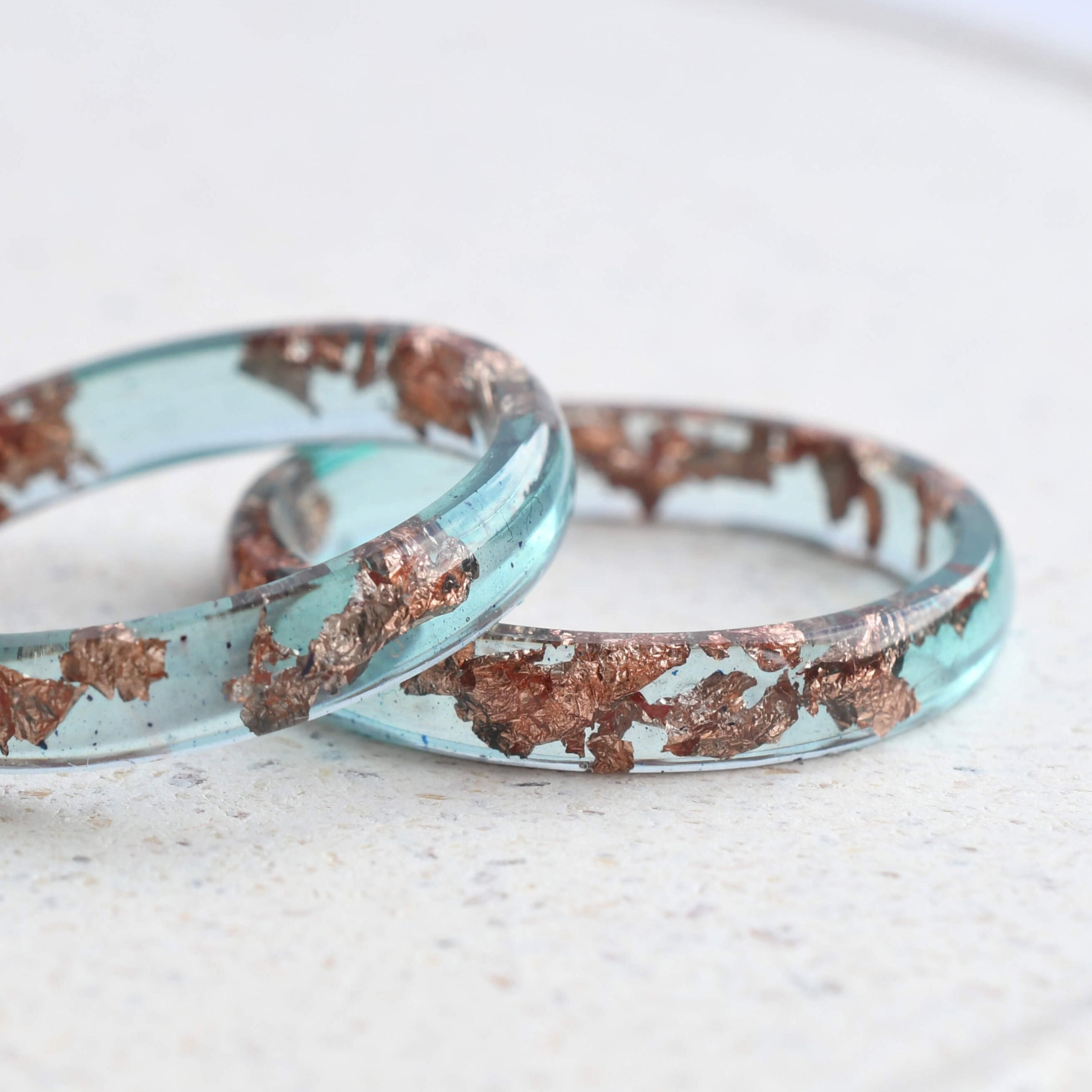 Handmade ocean blue resin ring with rose gold leaf detail — crafted in Vienna by Resity