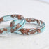 Handmade ocean blue resin ring with rose gold leaf detail — crafted in Vienna by Resity
