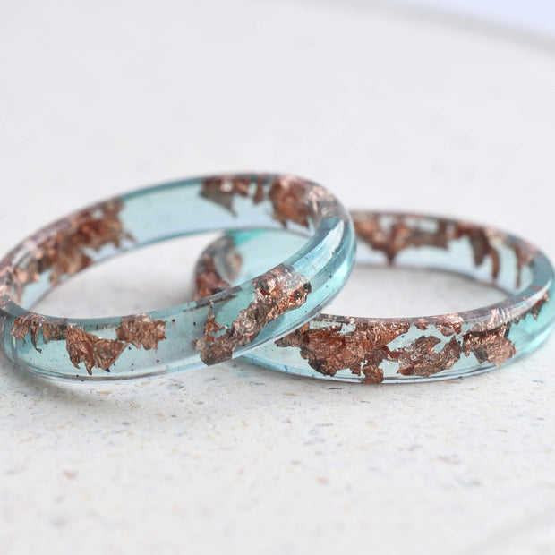 Handmade ocean blue resin ring with rose gold leaf detail — crafted in Vienna by Resity
