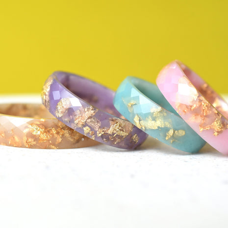 Faceted pastel resin rings with shimmering gold leaf — handmade jewelry