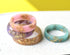 Close-up of gold flakes inside pastel resin handmade rings