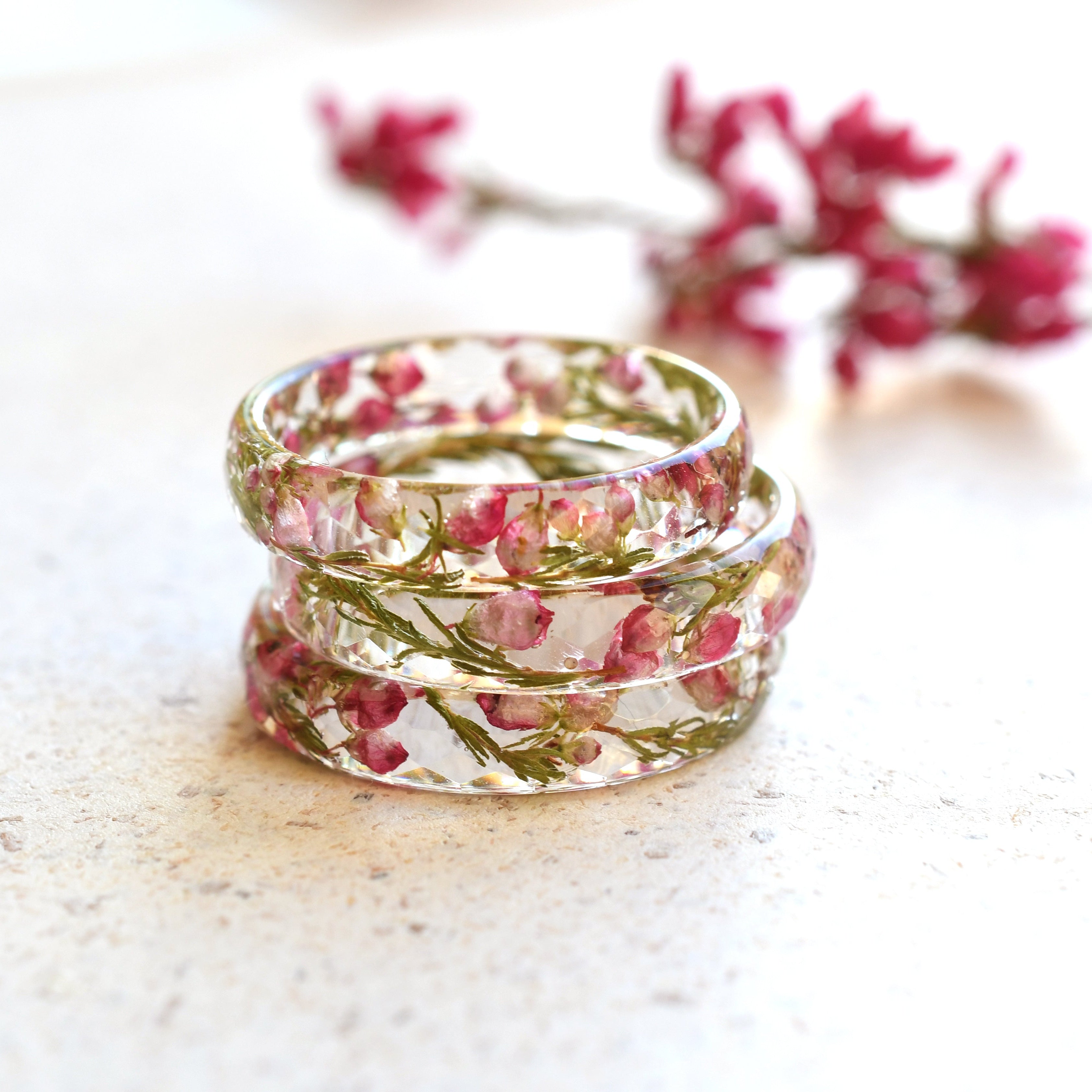 Delicate resin ring with dried pink heather flowers