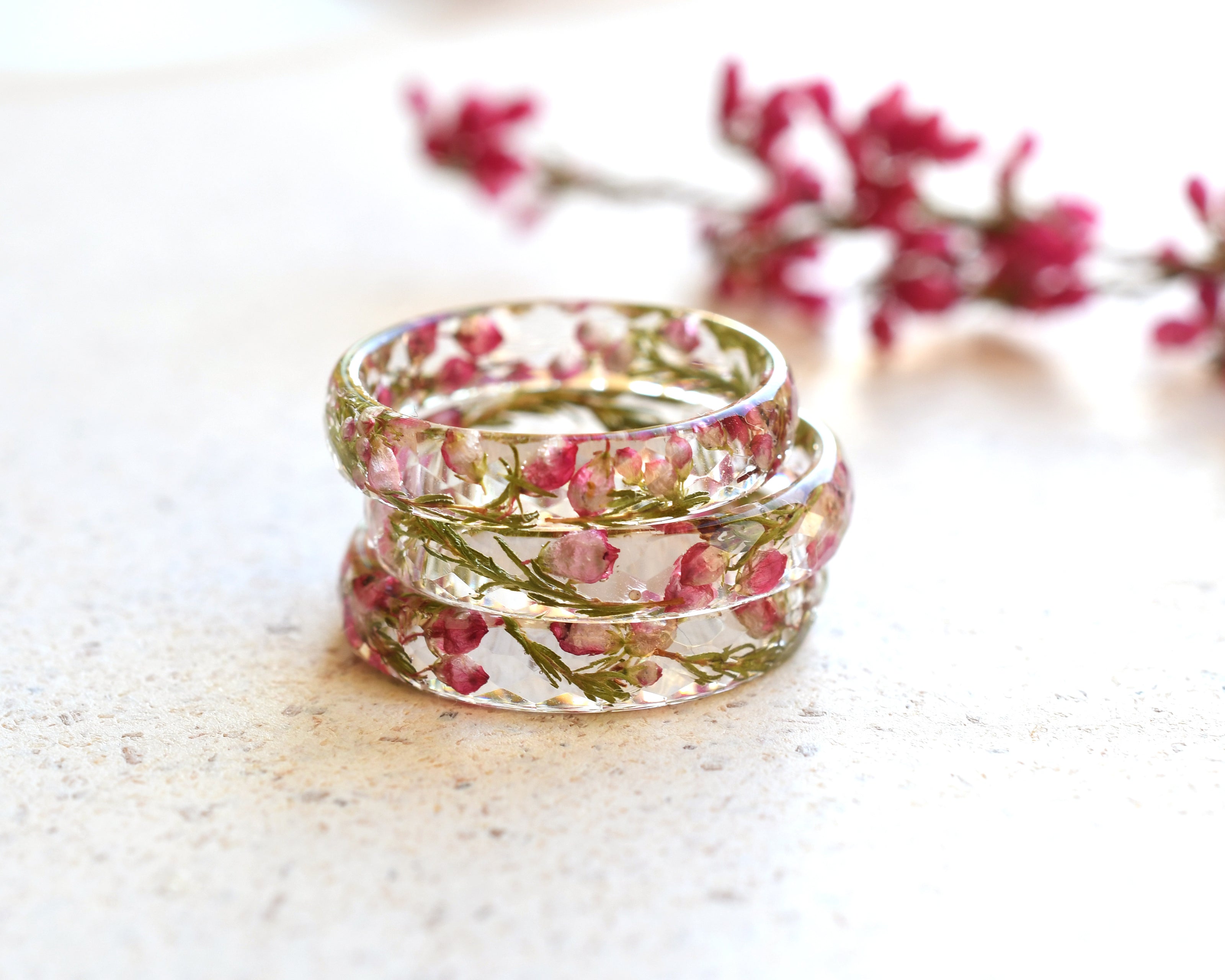 Delicate resin ring with dried pink heather flowers