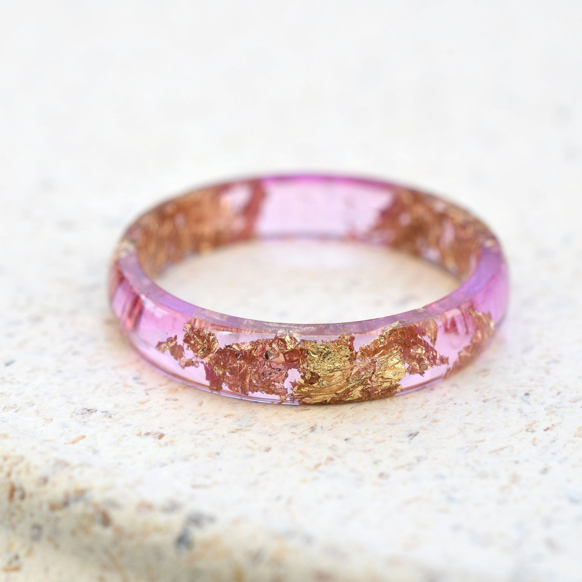 Smooth pink resin ring with shimmering gold flakes — minimalist handmade jewelry