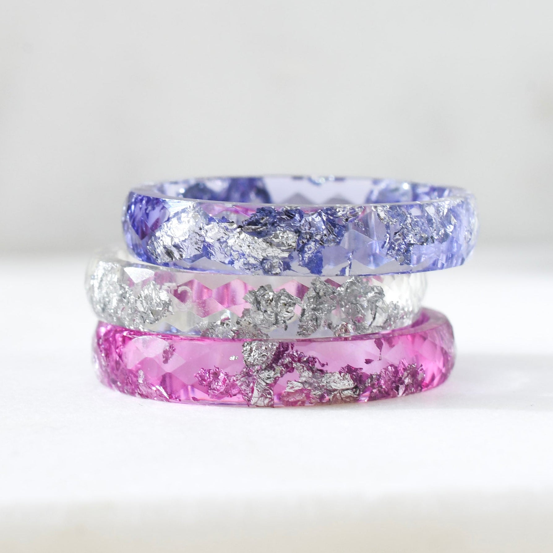 iris stack with pink, purple and clear resin rings with silver flakes