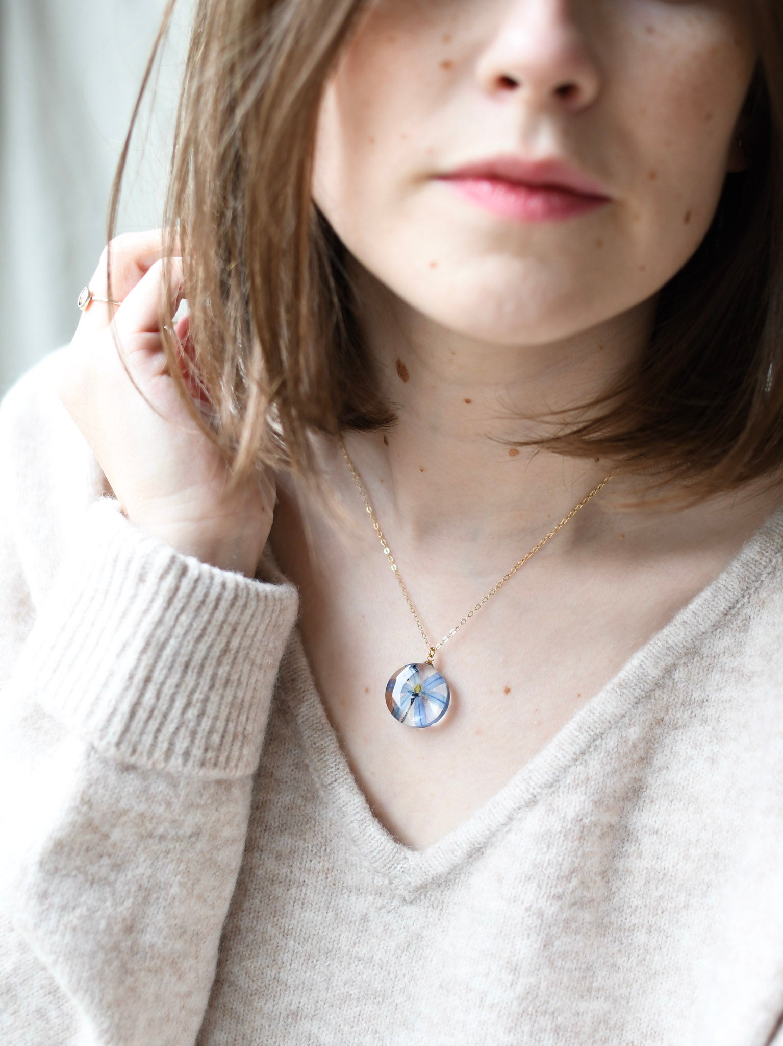 Pressed blue Siberian Squill pendant on a gold-filled chain, handmade in Austria