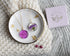 Pressed purple aster flower necklace in clear resin — 20 mm round botanical pendant