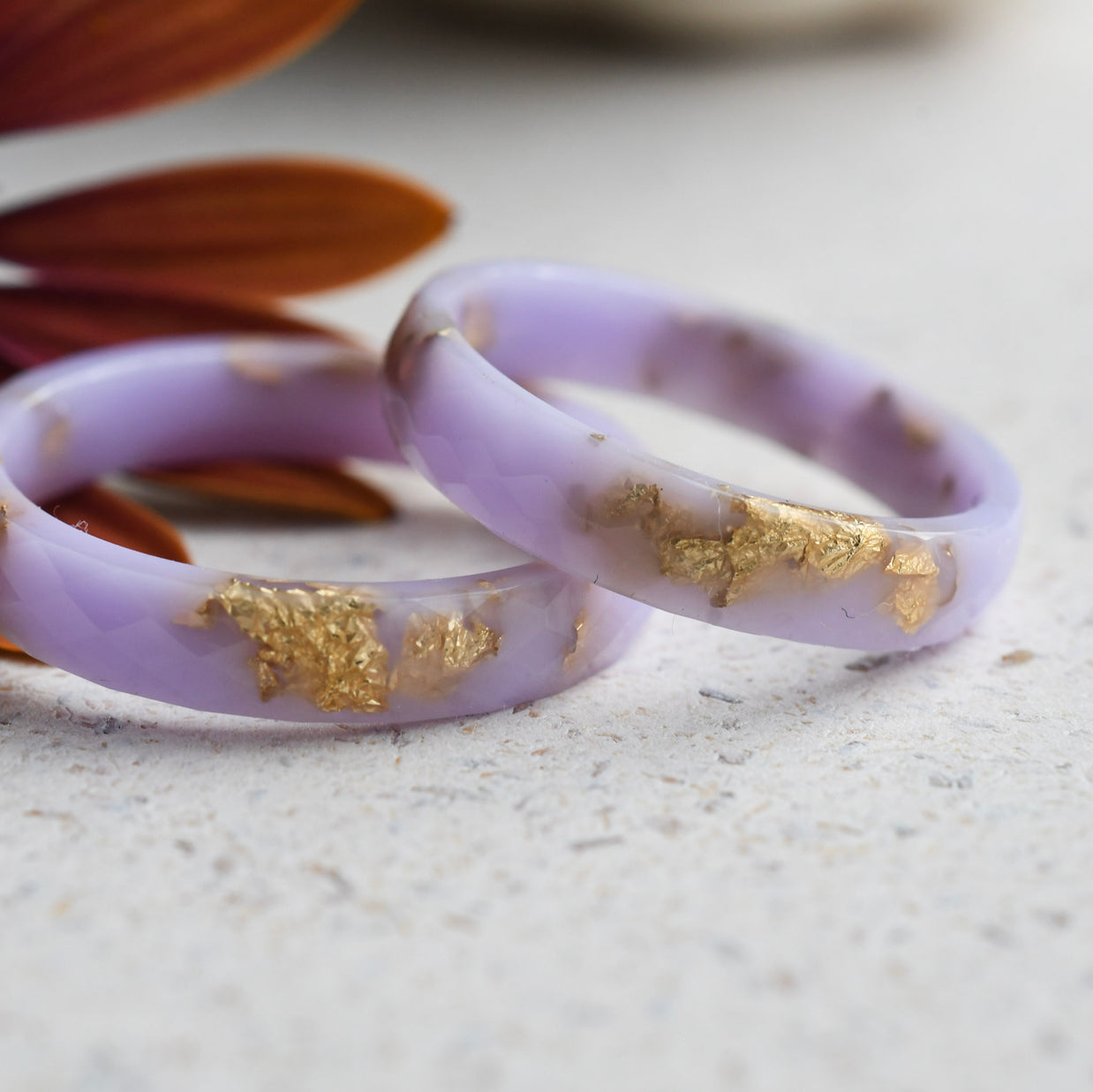 Smooth thin lavender resin ring with shimmering gold flakes