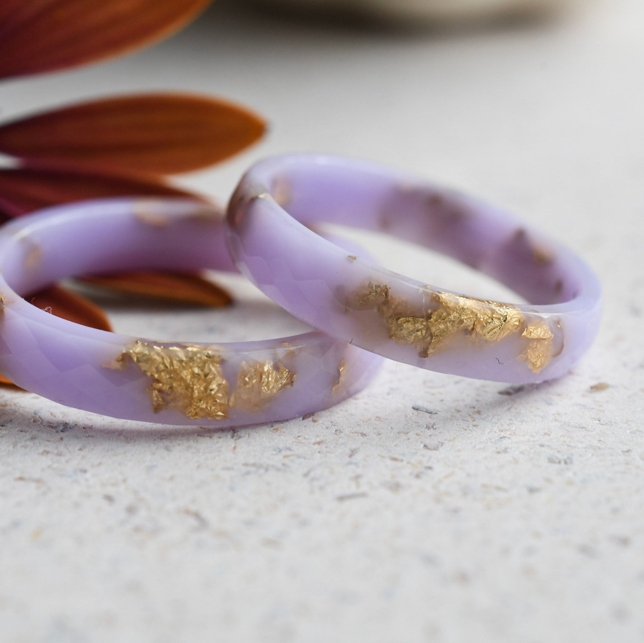 Smooth thin lavender resin ring with shimmering gold flakes