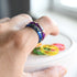 Close-up of gold leaf flakes inside rainbow resin — handcrafted ring by Resity