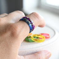 Close-up of gold leaf flakes inside rainbow resin — handcrafted ring by Resity