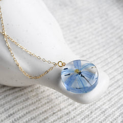 Real pressed Siberian Squill pendant in clear resin on a delicate gold chain