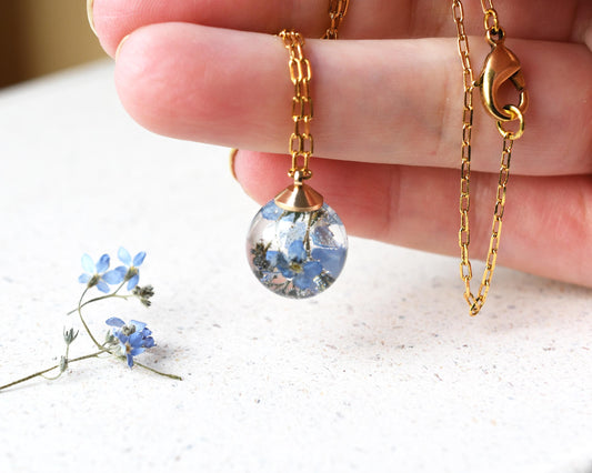 Hand holding pendant for size reference