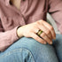 Resin stacking rings with gold flakes worn on hand