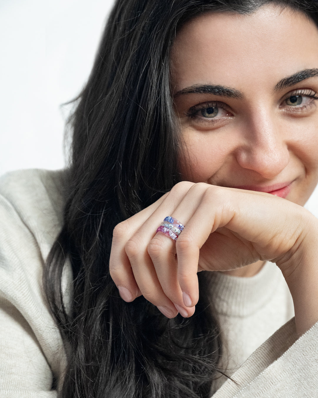 Resin stacking rings with silver flakes worn on hand