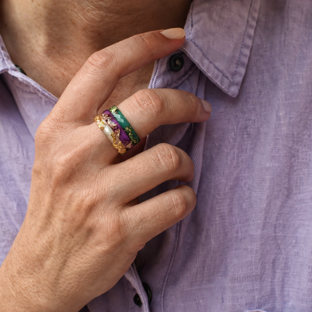 Three slim resin stacking rings worn together on hand