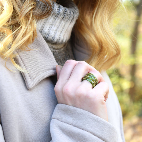 Moss green resin ring with gold flakes worn on hand — unisex minimalist jewelry