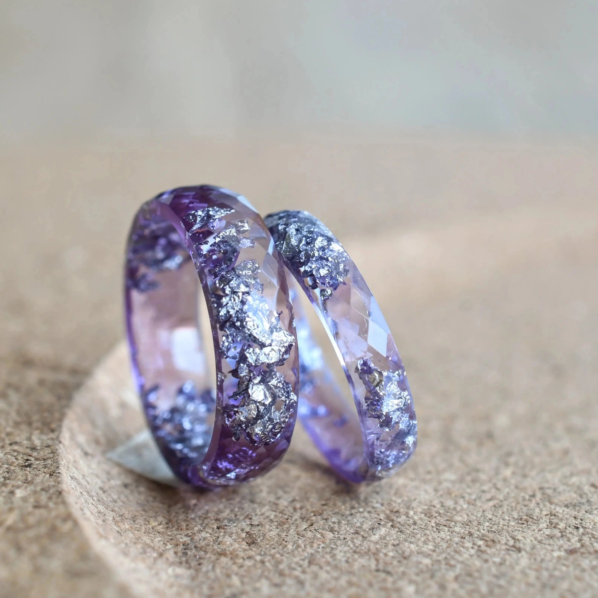 Two lavender resin rings with silver flakes by Resity