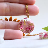 Pendant placed on a hand, showing the 20 mm diameter, useful for scale comparison before purchase.