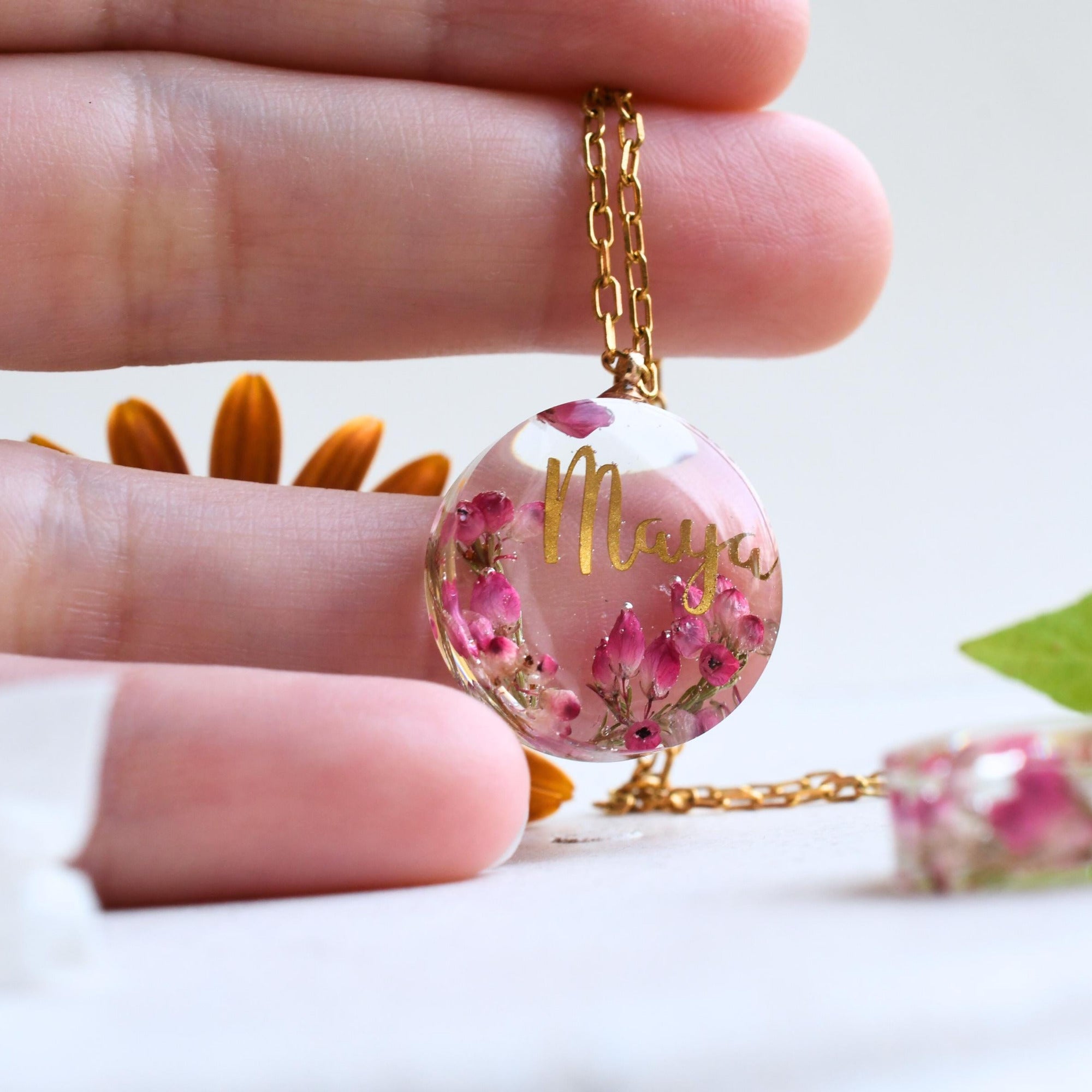Pendant placed on a hand, showing the 20 mm diameter, useful for scale comparison before purchase.