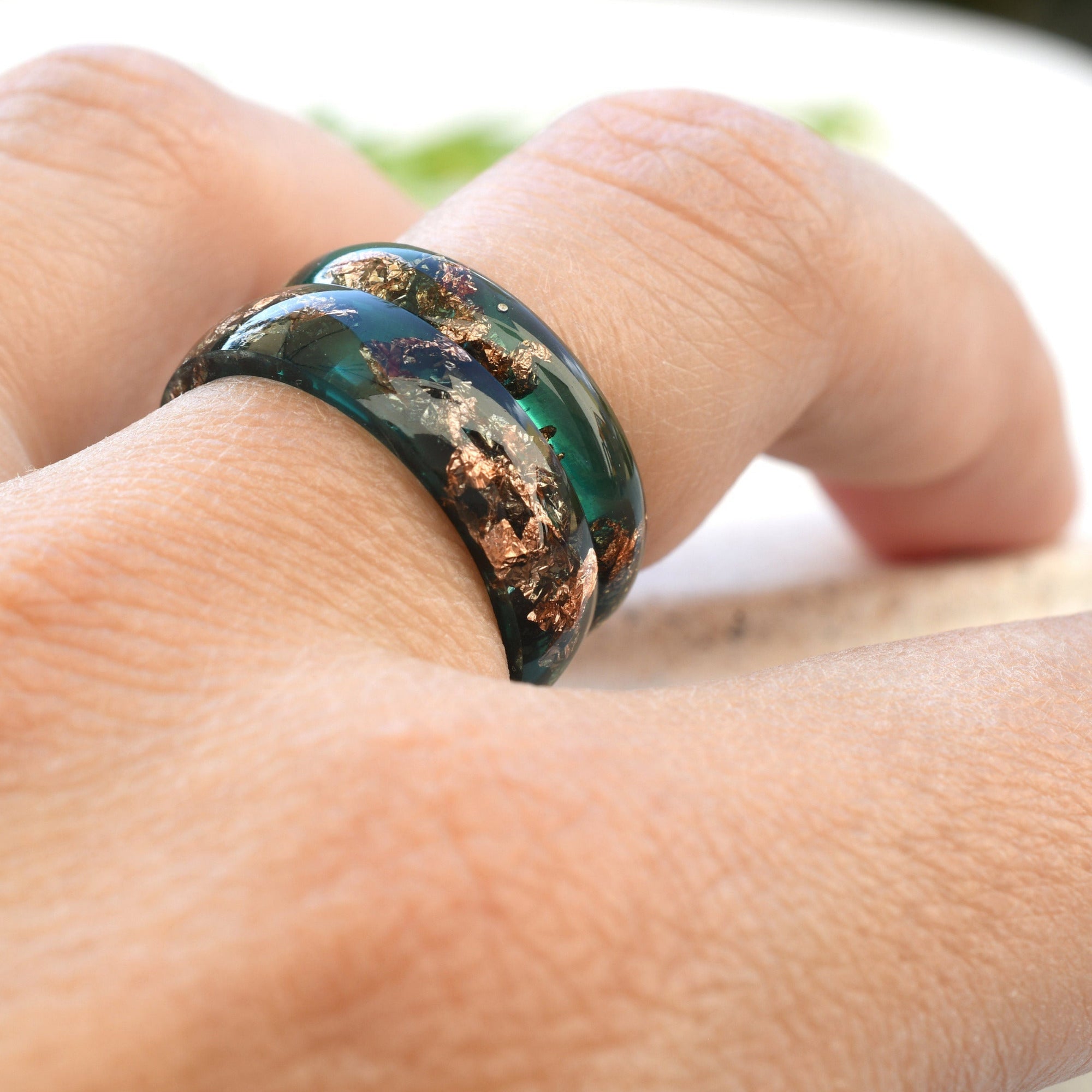 Matching jade resin rings worn by couple — unisex handmade design