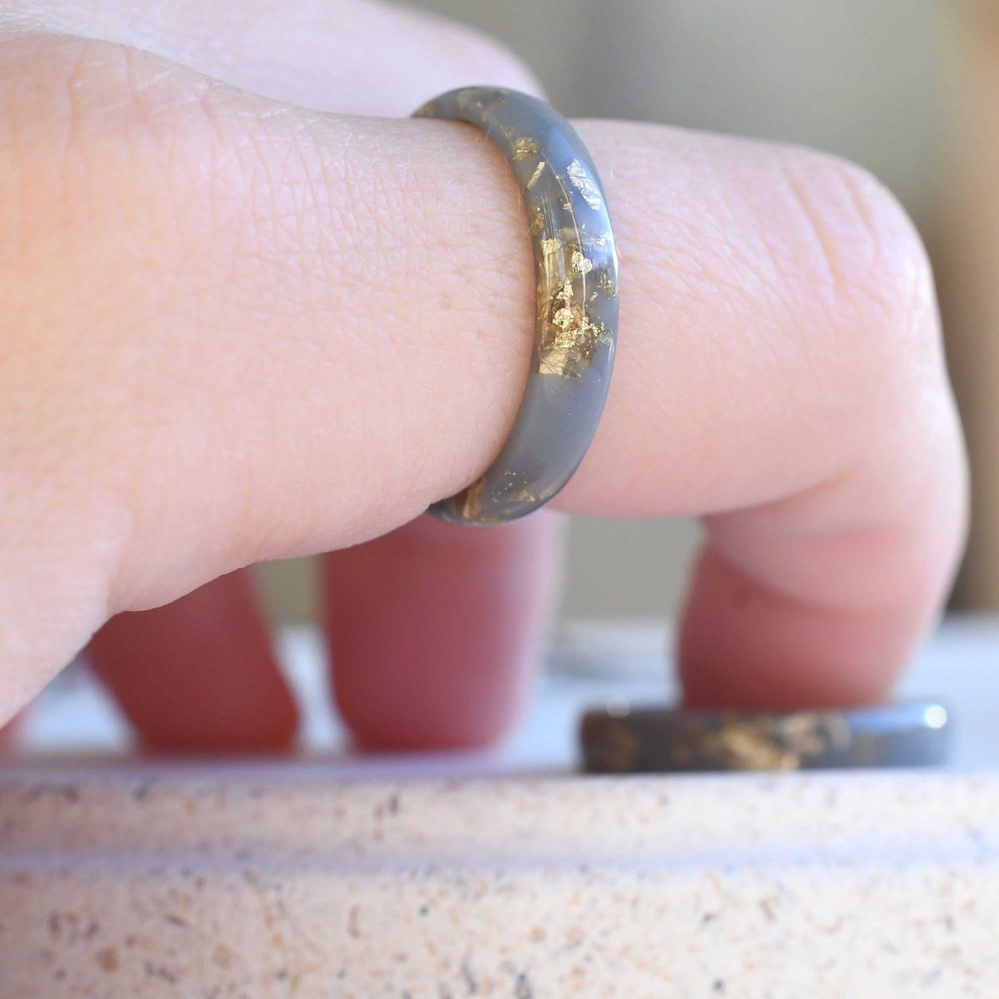 Handmade matte gray resin ring worn on hand — unisex modern design