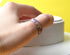 Stack of pastel resin rings worn on hand — minimalist everyday jewelry